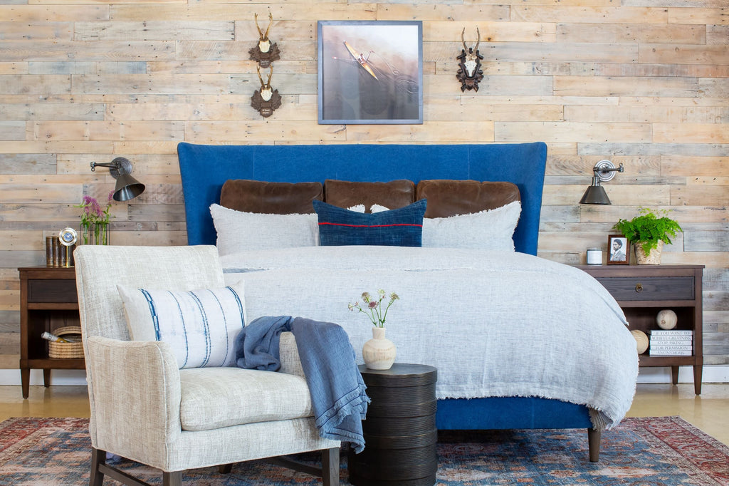 Franklin Upholstered Bed in Blue Fabric with Leather Welt Styled in Bedroom