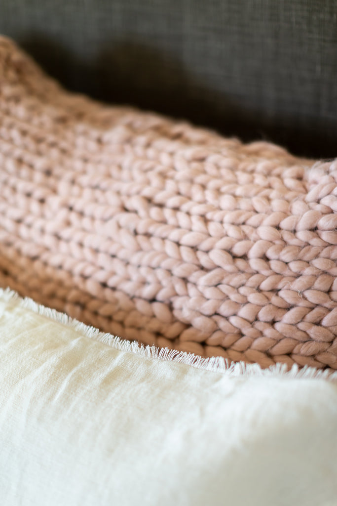 Close Up of Pink Chunky Knit Super King Sham on Bed